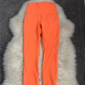Lululemon orange wunder train leggings 25”
